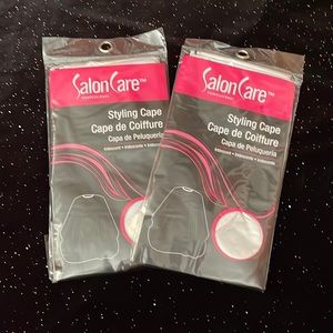 2 silver brand new styling capes!